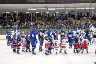 Marlies players salute the crowd at a community festival